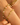 Close-up of the Stardust Bracelet in Mojito worn on the wrist alongside a freshwater pearl and peridot bracelet. The Mojito bracelet features a sparkling mix of faceted peridot, lemon quartz, and prehnite beads, separated by 14k gold spacer beads, creating a fresh and radiant look with natural color variation.