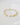 Close-up angled view of The Moonlet Bracelet in Golden Honey resting on a smooth white surface. The design showcases alternating organic-shaped freshwater pearls and yellow fluorite beads, each elegantly spaced by tiny polished 14k gold beads for a luminous, airy look.