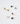 Collection of 14k gold capsule charms with assorted gemstone cabochons including citrine, peridot, topaz, garnet, moonstone, and black star sapphire.