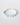 Front-focused close-up of the Crescent Bracelet showcasing the blue aquamarine beads, sterling silver spacers, and toggle clasp on a soft white surface.