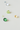 A collection of loose natural gemstones arranged on a soft white surface, including gray spinel, green tourmaline, golden topaz, a small blue sapphire, and a small peridot in various cuts and sizes.