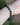 A close-up view of the bracelet worn on a wrist, showing the vivid bright blue and dark navy blue marbled Shattuckite beads and the central gold rondelle encrusted with tiny white diamonds. The natural stone beads have a smooth, glossy finish and are separated by subtle 14k gold spacers. The bracelet fits comfortably on the wrist, showcasing its elegant scale and craftsmanship against the model’s skin tone.