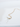 Pearl and diamond pendant necklace draped on reflective surface showing dainty gold cable chain detail.