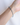 Close-up of the Stardust Single Bracelet in Aquamarine worn on the wrist, highlighting its minimalist silhouette made of shimmering blue aquamarine gemstones and subtle silver accents for a minimalist look.