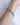 Close-up of the Stardust Double Bracelet in Aquamarine worn on the wrist, showcasing two strands of sparkling aquamarine gemstones separated by tiny silver beads, creating a light, layered look with soft shimmer.