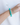 On-model  image of a hand wearing the NOVA Bracelet in Arctic Waters, illustrating the 10mm bead scale, natural stone texture, and icy blue-green tone of the amazonite beads.